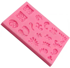 Pink silicone fern leaf fondant mold for cake decoration with embossed floral patterns