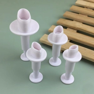 Set of 4 white oval spring-loaded fondant embossers and cookie cutters for DIY cake baking