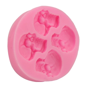 Pink silicone mold featuring four 3D baby shapes for fondant and DIY cake decorating