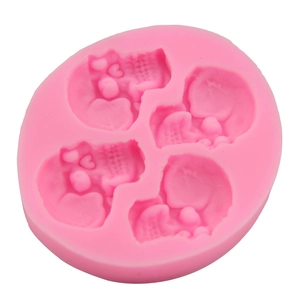 Pink silicone skull mold with four cavities for chocolate cake and DIY baking fondant