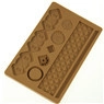 Detail of a brown silicone gingerbread house mold for chocolate and fondant baking