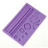 Detailed macro view of purple silicone fondant mat with various flower and leaf patterns