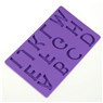 Detailed macro view of purple silicone mold with embossed alphabet for cake decorating