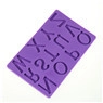 Macro detail of purple silicone fondant mold featuring embossed alphabet letters for cakes