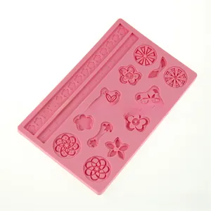 Close-up of pink silicone flower mold with cherry blossom patterns for fondant cake