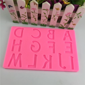 Pink silicone mold featuring uppercase letters A-M for fondant cake decoration and baking