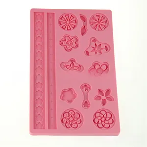 Macro detail of pink silicone fondant mold featuring floral patterns and lace borders