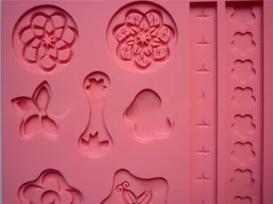 Pink silicone mold detail showing intricate floral petal textures and star patterns