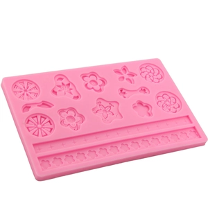 Pink silicone fondant mold featuring assorted flower shapes and lace border textures