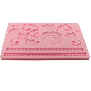 Pink silicone mold featuring rose floral patterns and bead trim for DIY cake baking