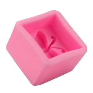 Detailed macro view of pink silicone butterfly mold with intricate wing textures