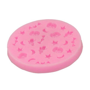 Detail view of pink silicone mold with Halloween star moon pumpkin and bat shapes