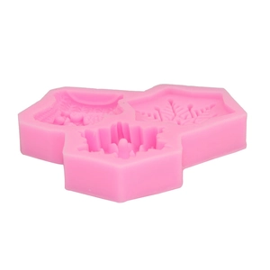 Detailed macro view of pink silicone mold with snowflake and leaf texture for baking DIY