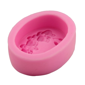 Macro detail of pink silicone mold with intricate lotus flower patterns for DIY baking