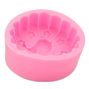 Detailed macro view of pink silicone mold with floral patterns for DIY fondant and soap