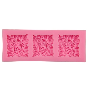 Pink silicone mold with detailed floral and leaf patterns for fondant and soap making