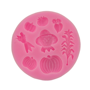 Pink silicone mold with pumpkin and corn shapes for DIY fondant and chocolate baking