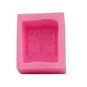 Pink silicone mold featuring a detailed tree relief design and Natural letter engraving