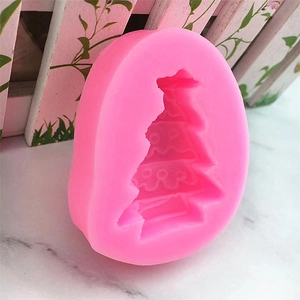 Pink silicone Christmas tree cake mold for DIY baking and handmade soap making