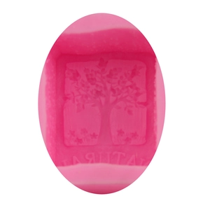 Macro detail of pink silicone mold featuring an intricate tree design and natural text