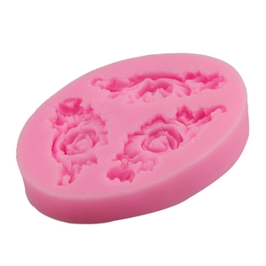 Pink silicone cake mold with three detailed rose flower designs for DIY baking and crafts