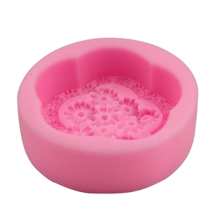 Macro shot of pink silicone flower mold for DIY daisy soaps and baking cakes