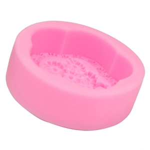 Close-up of pink silicone mold with floral embossed patterns for DIY baking and crafts
