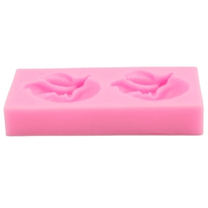 Dettaglio stampo in silicone rosa a forma di foglia con venature per decorazioni