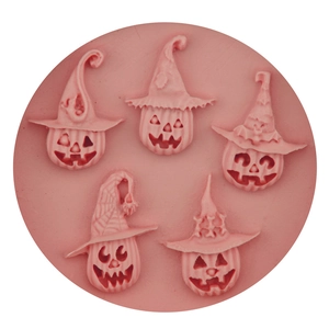 Pink Halloween pumpkin molds with wizard hats for DIY cake decorating and baking