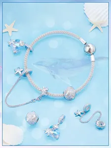Detail view of S925 sterling silver ocean charm bracelet with Forever Family engraving