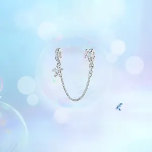 Detail view of S925 silver starfish and turtle safety chain charm with blue zircon stones