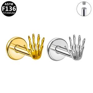 Detailed macro of internal threaded G23 titanium skeleton hand stud earrings set