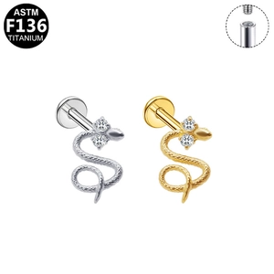 Macro detail of G23 titanium snake labret studs with internal threading and cubic zirconia