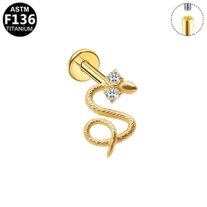 Detail of G23 titanium gold snake labret with internal threading and zircon eyes