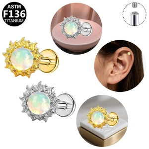 Detail of sunflower ASTM F136 titanium piercing stud with opal stone and flat back