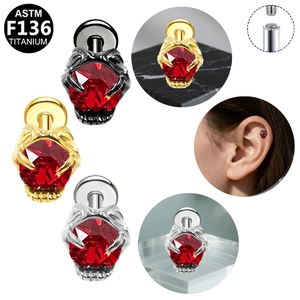 G23 titanium internal threaded ear stud with red gemstone in claw setting detail