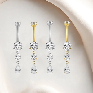 Detail of F136 titanium belly button rings with teardrop zircon in gold and silver