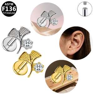 Macro view of G23 titanium ginkgo leaf stud earring with zircon and internal thread