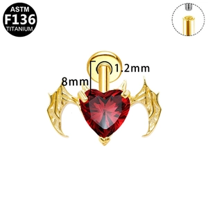 Macro detail of G23 titanium heart stud with bat wings and internal thread structure