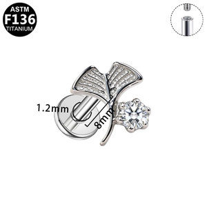 Detailed view of G23 titanium ginkgo leaf piercing stud with sparkling CZ stones