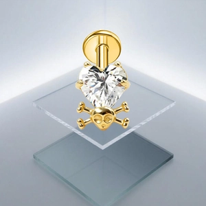 G23 titanium gouden navelpiercing met hartvormige zirkoon en schedel met botten hanger