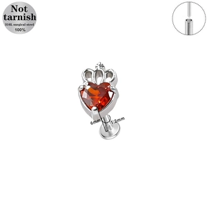 Surgical steel piercing with red heart-shaped zircon and hollow crown ornament