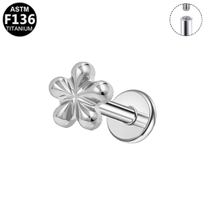 Detailed macro view of silver titanium flower stud featuring an internal thread structure