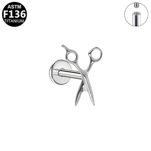 Detailed macro view of scissors-shaped G23 titanium labret stud with internal threading