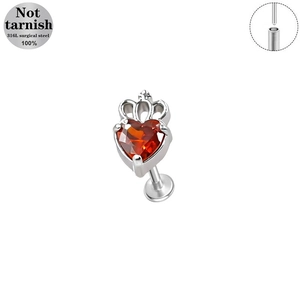 Detailed macro view of heart crown labret stud in 316L surgical steel with red gem