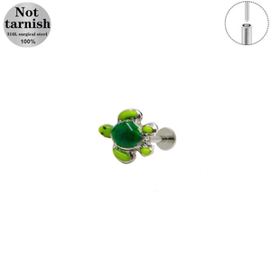 Macro detail of a 316L surgical steel turtle labret stud with green enamel shell