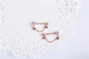 Teardrop crystal nipple ring with rose gold chain and purple star cubic zirconia