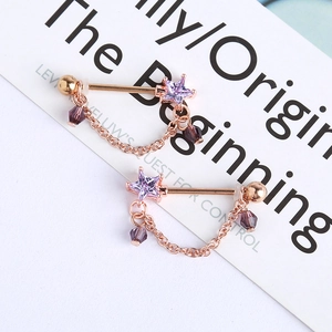 Rose gold teardrop nipple rings with purple star rhinestone and beaded chain dangle