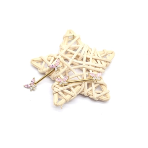 Pink and white zircon butterfly nipple rings with golden bars on a white background