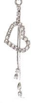 Silver heart navel ring with long tassel and sparkling crystals for belly piercing